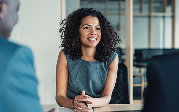 A woman meeting with her clients.