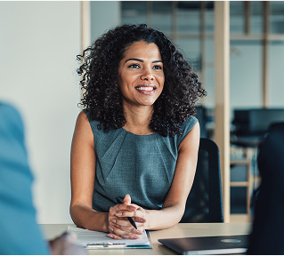 A woman meeting with her clients.