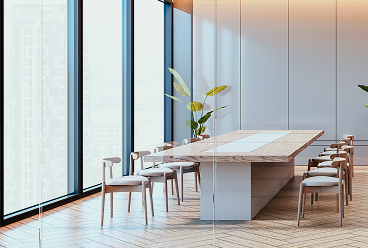 A modern and bright boardroom with light wood features and clean lines.