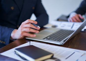 A person typing on a computer.