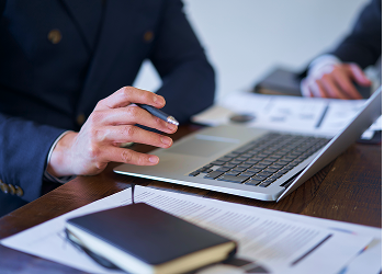 A person typing on a computer.
