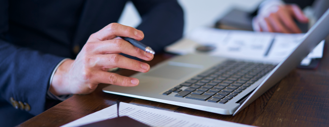 A person typing on a computer.