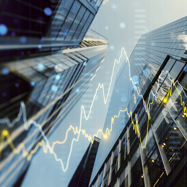 A bottom-up view of buildings in the financial district with a graphic overlay of the financial markets.