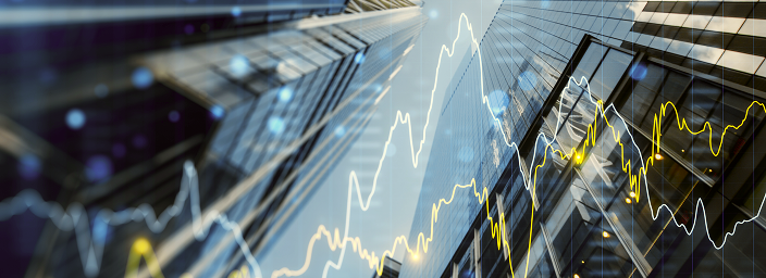 A bottom-up view of buildings in the financial district with a graphic overlay of the financial markets.