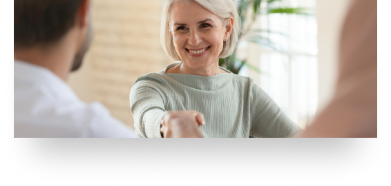 woman shaking hands with man